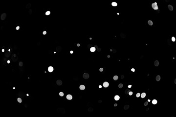 Texture of falling snow, volumetric snow bokeh on a black background