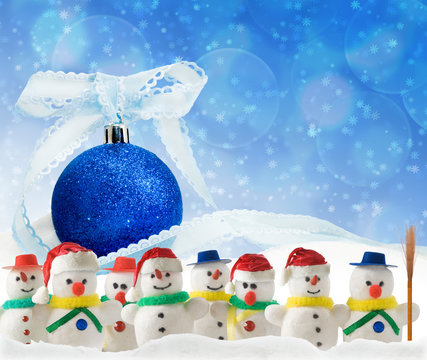 image of stylized snowmen on the background of Christmas decorations