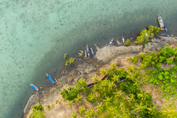 Aerial view of Sea Gypsy water village, island and the ocean with sky in Semporna, Sabah, Malaysia,...