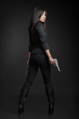 Young woman with pistols