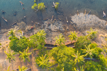 Aerial view of Sea Gypsy water village, island and the ocean with sky in Semporna, Sabah, Malaysia, Borneo.