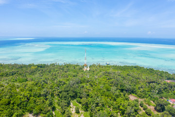 Aerial view of Sea Gypsy water village, island and the ocean with sky in Semporna, Sabah, Malaysia,...