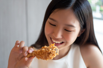 hungry woman looking, eating fried chicken, concept of delicious food, health care, eating habit,...