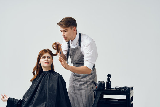 A Man Makes A Haircut To A Woman