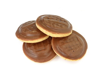 Chocolate coated biscuit cakes with the orange filling isolated over the white background.