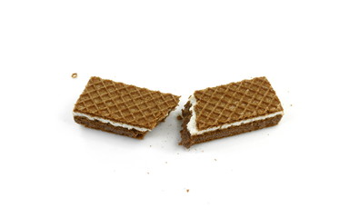 Broken stacked chocolate wafers isolated on a white background
