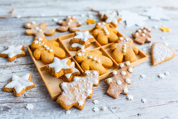 Homemade Christmas gingerbread cookies on wooden background.