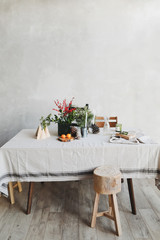 Festive kitchen in Christmas decorations. Christmas dining room. Beautiful New Year decorated classic home interior. New Year and Christmas background