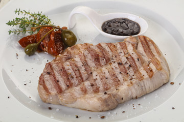 Grilled pork steak with pepper sauce