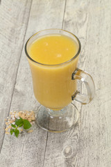 Dietary vegetarian oats milk over wooden