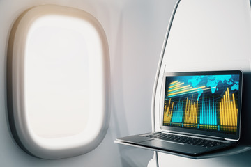 Laptop closeup inside airplane with forex graph and world map on screen. Financial market trading concept. 3d rendering.