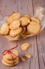 Homemade tasty cookies with parchment paper on the table.