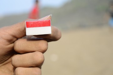 Indonesian Flag among the sand