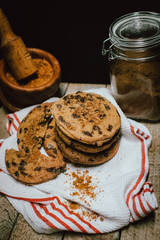 Freshly baked chocolate chip cookies on rustic wooden table