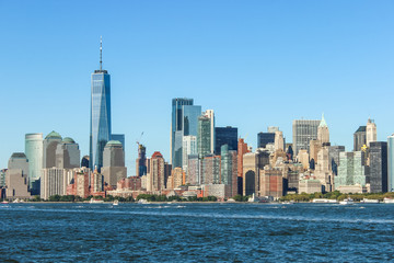 Clean and natural look on the skyline of New York on a clear sky day, low angle horizon, USA
