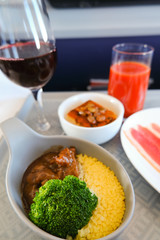 photo of Food served on board of business class airplane on the table