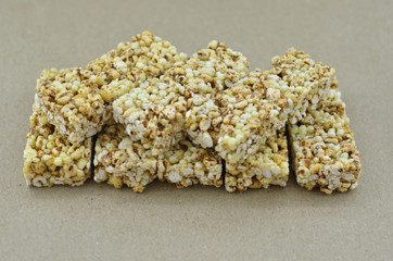 Delicious cereal bars on wooden background.