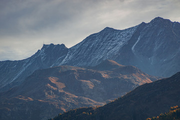 The Swiss Alps at sunset in Engadin valley, near the village of Sankt Moritz, Switzerland - October 2019.