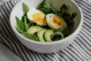 healthy green salad. Boiled eggs, herbs, onions and dressing. 