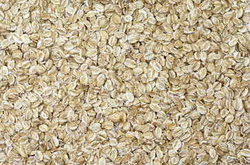 Rye oat flakes isolated on white , macro close up