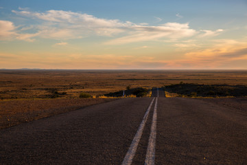Fototapeta na wymiar Outback highway near Silverton, New South Wales, overlooking the Mundi Mundi Plains.