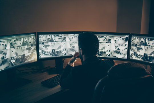 Rear Back Behind View Of His He Professional Professional Man Safeguard Supervising Online Remote Panel Night Shift Providing Company Safety Late Evening At Work Workplace Workstation