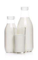 Bottles and glass with milk drink, isolated on white background