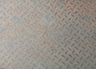 Rusty steel sheet checkered plate backgrounds and textures closeup for wallpaper interior design wallpaper.