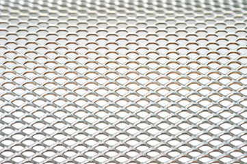 Close-up metal mesh structure with equal intervals of holes