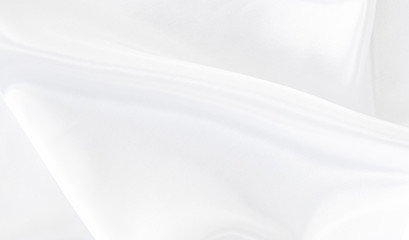 White gray satin texture that is white silver fabric silk background with beautiful soft blur...