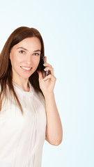 Young girl with mobilephone. Business woman talking on phone. Adorable caucasian businesswoman shopping