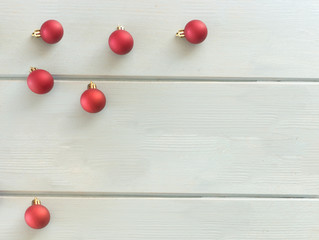 Naklejka na ściany i meble Creative image of a red ornaments a background of whiteboards.Christmas holiday, New Year 2020.Place for your text.