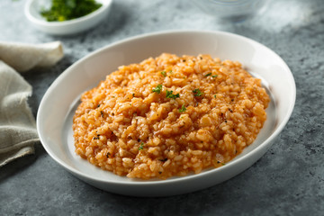 Homemade tomato risotto with herbs