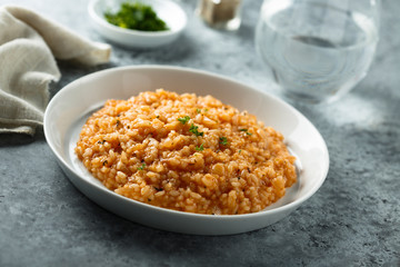 Homemade tomato risotto with herbs