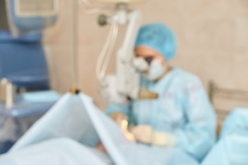 Ophthalmology laser microscope operation. Clinic room with doctor and parient. Blur background....