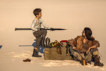 Post Apocalyptic Woman and Boy Outdoors in the Wasteland