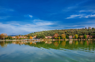 Isola Maggiore (Greater Island) of Lake Trasimeno in Umbria, with small village waterfront and the medieval St Micheal Archangel church at the top