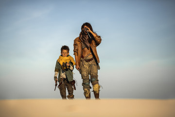 Fototapeta na wymiar Post Apocalyptic Woman and Boy Outdoors in the Wasteland
