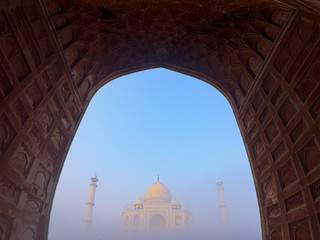 Taj Mahal in the fog at Indian city of Agra, Uttar Pradesh, India.