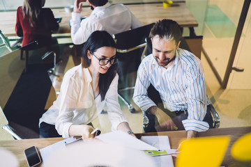 Fototapeta premium Colleagues discussing work related documents