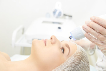 Naklejka premium Dermatology skin care facial therapy. Medical spa anto wrinkles procedure. Woman face rejuvenation. Pretty girl. Rf cosmetician equipment