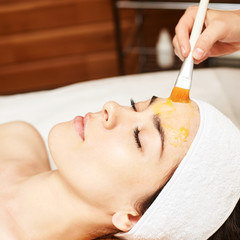 Obraz na płótnie Canvas chemic facial and body peel. Cosmetology acne treatment. Young girl at medical spa salon