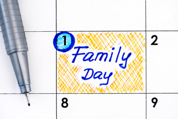Reminder Family Day in calendar with pen.