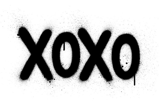 graffiti XOXO sign sprayed in black over white