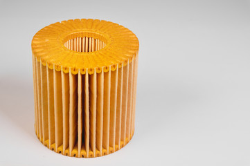 Replaceable cartridge fuel system. New fuel filter element on a gray gradient background