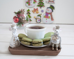 cup of tea with cookies and flowers