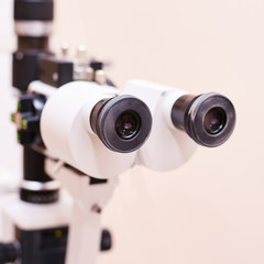 ophthalmologist doctor in exam optician laboratory with female patient. Eye care medical diagnostic. Eyelid treatment