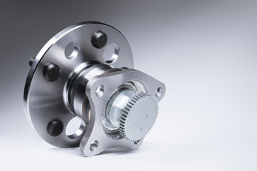New Wheel hub assembly with bearing. This is part of the car suspension on a gray background with a...
