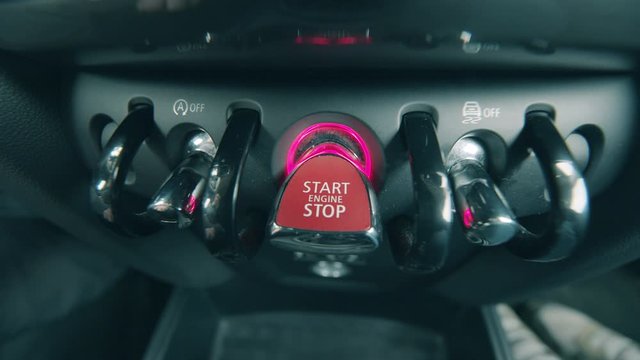 Start stop switcher is getting pressed on the vehicle's dashboard