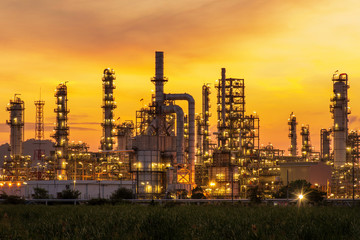 Plakat oil refinery at sunset